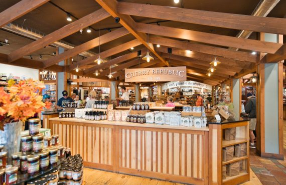Warm interior shot of the Cherry Republic store showcasing wood decor and products.