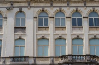 Beautiful historic building façade with arched windows in Oostende, Belgium.