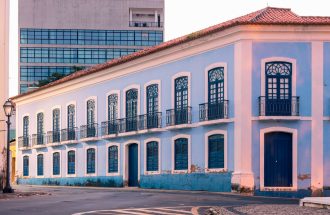 Charming colonial blue building with classic architecture in Maranhão, Brazil, during the evening light.